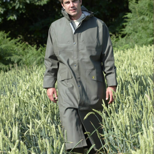 Guy cotten Isofarmer Long Coat - man wearing in long grass with Guy Cotten Pouldo Pants