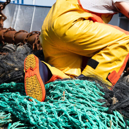 Bekina StepliteX StormGrip Gumboots with Guy Cotten Xtrapper Heavy Duty Bib & Braces and on a fishing boat with nets