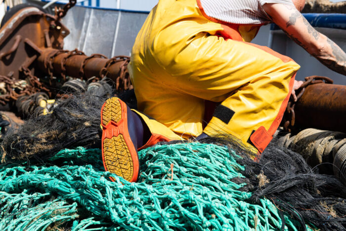 Bekina StepliteX StormGrip Gumboots with Guy Cotten Xtrapper Heavy Duty Bib & Braces and on a fishing boat with nets